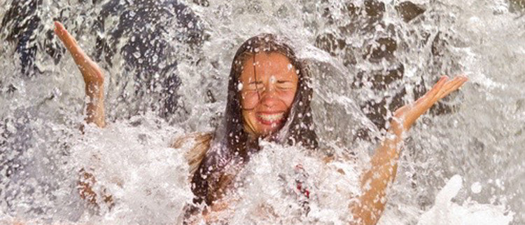 Love and Sex Coaching start with the body. Joyful woman in water